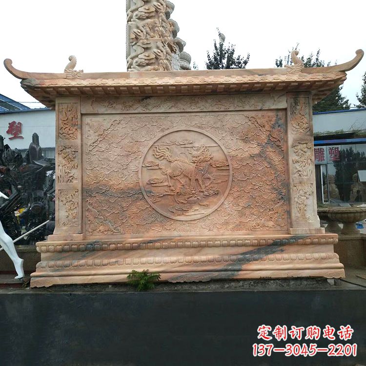 海南晚霞红麒麟影壁墙石雕